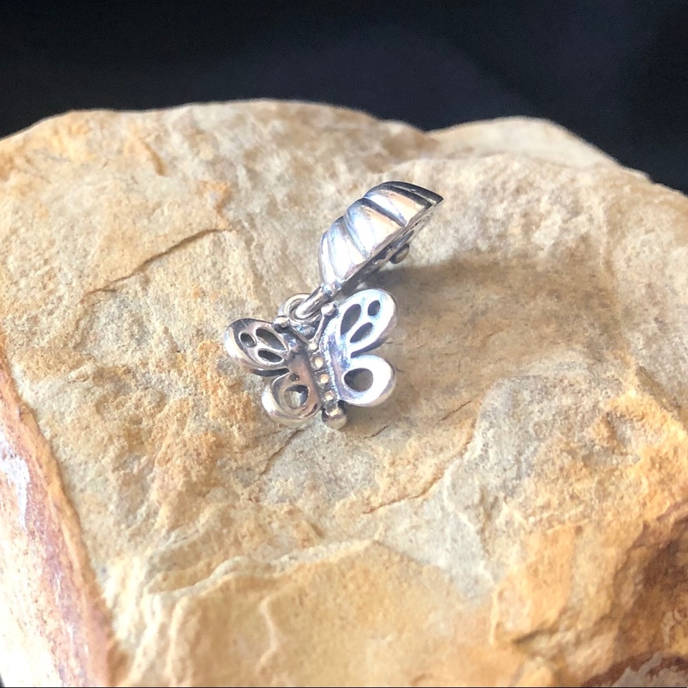 One half of Pandora friendship butterfly